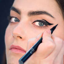 Model Applying Black Eyeliner 